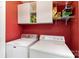 Functional laundry room with washer, dryer, and cabinets for storage at 7305 Park Vista Cir, Charlotte, NC 28226