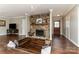 Unique living room with fireplace and hearth seating area, wood floors, and front door view at 7305 Park Vista Cir, Charlotte, NC 28226