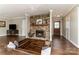 This living room features a stone fireplace, wood floors, and recessed seating at 7305 Park Vista Cir, Charlotte, NC 28226