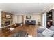 Cozy living room with stone fireplace, hardwood floors, and natural light at 7305 Park Vista Cir, Charlotte, NC 28226