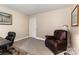 A cozy living room with an accent chair and a desk to work from home at 7305 Park Vista Cir, Charlotte, NC 28226