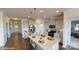 Modern kitchen boasts an island, stainless steel appliances, and sleek white cabinetry at 7669 Bainbridge Rd, Sherrills Ford, NC 28673