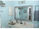 Light and airy bathroom with a large mirror, white vanity, and ample natural light at 8149 Cedar Glen Dr # 8149, Charlotte, NC 28212