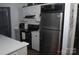 Modern kitchen boasts stainless steel appliances and bright white cabinets at 8149 Cedar Glen Dr # 8149, Charlotte, NC 28212