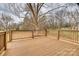 Spacious wooden back deck overlooking a large backyard perfect for outdoor entertaining and relaxation at 818 E Charles St, Matthews, NC 28105