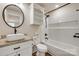 Modern bathroom with granite countertop, stylish sink, and tiled shower/tub combo at 818 E Charles St, Matthews, NC 28105