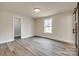 Bright bedroom with closet and outdoor views at 818 E Charles St, Matthews, NC 28105