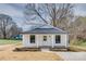 Lovely home with a welcoming porch, a well-manicured yard, and a newly constructed driveway at 818 E Charles St, Matthews, NC 28105