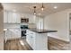 Stylish kitchen featuring white cabinets, stainless steel appliances, and a functional center island at 818 E Charles St, Matthews, NC 28105