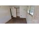 Carpeted bedroom with a window, closet, and wood paneling at 819 Circle Vw, Gastonia, NC 28054