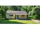Charming one-story home featuring a quaint porch and a blue front door at 819 Circle Vw, Gastonia, NC 28054