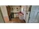 Kitchen area featuring upper and lower cabinets, laminate countertops, and a double basin sink at 819 Circle Vw, Gastonia, NC 28054