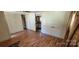 Spacious living room featuring hardwood floors and a view to the kitchen at 819 Circle Vw, Gastonia, NC 28054