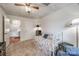 Bright bedroom featuring a daybed, soft carpet, ceiling fan, and a view into the hallway at 84 Lake Concord Ne Rd # S, Concord, NC 28025