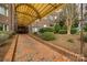 Covered brick walkway to building entrance, showcasing professional landscaping and a well-maintained exterior at 84 Lake Concord Ne Rd # S, Concord, NC 28025