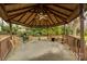 Community gazebo featuring multiple chairs and tables, as well as a grill, perfect for gatherings at 84 Lake Concord Ne Rd # S, Concord, NC 28025