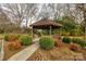 Attractive community gazebo nestled in lush landscaping, offering seating and a grill for outdoor enjoyment at 84 Lake Concord Ne Rd # S, Concord, NC 28025