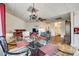 Open-concept living room and dining area with hardwood floors and a modern chandelier at 84 Lake Concord Ne Rd # S, Concord, NC 28025