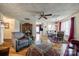 Bright open-concept living room featuring hardwood floors and view into the kitchen and dining area at 84 Lake Concord Ne Rd # S, Concord, NC 28025