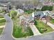 Aerial view of a neighborhood featuring well-manicured lawns and a two-story house with a two car garage at 8620 Grey Squirrel Ct, Charlotte, NC 28277