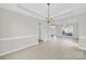 Bright dining area with tile flooring and modern lighting at 8620 Grey Squirrel Ct, Charlotte, NC 28277