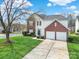 Beautiful two-story home with a well-maintained lawn, brick accents, and an attached two-car garage at 8620 Grey Squirrel Ct, Charlotte, NC 28277