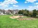 Community playground with swings, slides, and picnic area at 8620 Grey Squirrel Ct, Charlotte, NC 28277