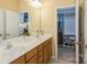 Bathroom with double sinks and large mirror, providing ample space and elegance at 8633 Sequoia Grove Ln, Charlotte, NC 28214