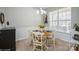 Cozy dining room with natural light and a round table set for four, creating a comfortable space for gatherings at 8633 Sequoia Grove Ln, Charlotte, NC 28214