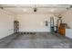 Spacious two car garage, featuring ample storage and a concrete floor at 8633 Sequoia Grove Ln, Charlotte, NC 28214