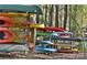 Organized kayak storage rack with colorful kayaks and canoes for lake adventures and recreational activities at 8633 Sequoia Grove Ln, Charlotte, NC 28214