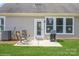 Outdoor patio featuring a seating area, grill, and door leading into the home at 8633 Sequoia Grove Ln, Charlotte, NC 28214