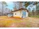 Exterior of a large barn featuring metal siding, a large sliding door, and ample space for storage and projects at 9026 Nc 10 Hwy, Vale, NC 28168