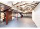 Unfinished basement with painted floor, brick columns and ceiling insulation at 9026 Nc 10 Hwy, Vale, NC 28168