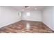 Bright bedroom features hardwood floors, white walls and trim, and natural light at 9026 Nc 10 Hwy, Vale, NC 28168