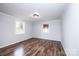 Bedroom features hardwood floors, white walls and trim, recessed lighting and natural light at 9026 Nc 10 Hwy, Vale, NC 28168