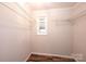 Walk-in closet with hardwood floors, fresh paint, and wire shelving at 9026 Nc 10 Hwy, Vale, NC 28168