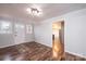 Inviting entryway with wood-look floors, a colorful rug, and access to the kitchen at 9026 Nc 10 Hwy, Vale, NC 28168