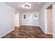 Bright entryway featuring wood-look floors, fresh paint, a modern ceiling fixture, and natural light at 9026 Nc 10 Hwy, Vale, NC 28168