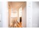 Hallway featuring hardwood floors and white trim at 9026 Nc 10 Hwy, Vale, NC 28168