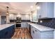 Spacious kitchen featuring modern appliances, an island, granite countertops, and ample cabinetry at 9026 Nc 10 Hwy, Vale, NC 28168