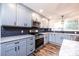 Updated kitchen featuring gray cabinets, granite countertops, and stainless steel appliances at 9026 Nc 10 Hwy, Vale, NC 28168