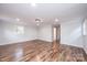 Spacious living room features hardwood floors, white walls and trim, and recessed lighting at 9026 Nc 10 Hwy, Vale, NC 28168