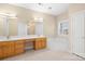 Large bathroom with double vanity sinks, large mirror, a soaking tub, and neutral color palate at 9433 Gilpatrick Ln, Huntersville, NC 28078