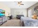 Comfortable bedroom featuring soft carpet, a ceiling fan, and ample natural light at 9433 Gilpatrick Ln, Huntersville, NC 28078