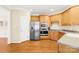 Well-lit kitchen featuring stainless steel appliances and light wood cabinets at 9433 Gilpatrick Ln, Huntersville, NC 28078