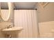 Comfortable bathroom with a classic sink, framed mirror, and a textured shower curtain at 1020 Saint Paul Church Rd, Clover, SC 29710