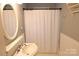 Cozy bathroom featuring a classic sink, framed mirror, and a textured shower curtain at 1020 Saint Paul Church Rd, Clover, SC 29710