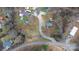 Overhead view showcasing the property, highlighting surrounding woods, road access, and neighboring homes at 109 Dogwood Dr, Hickory, NC 28601