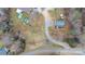 An aerial view of the property showcases a gravel driveway and the neighborhood at 109 Dogwood Dr, Hickory, NC 28601